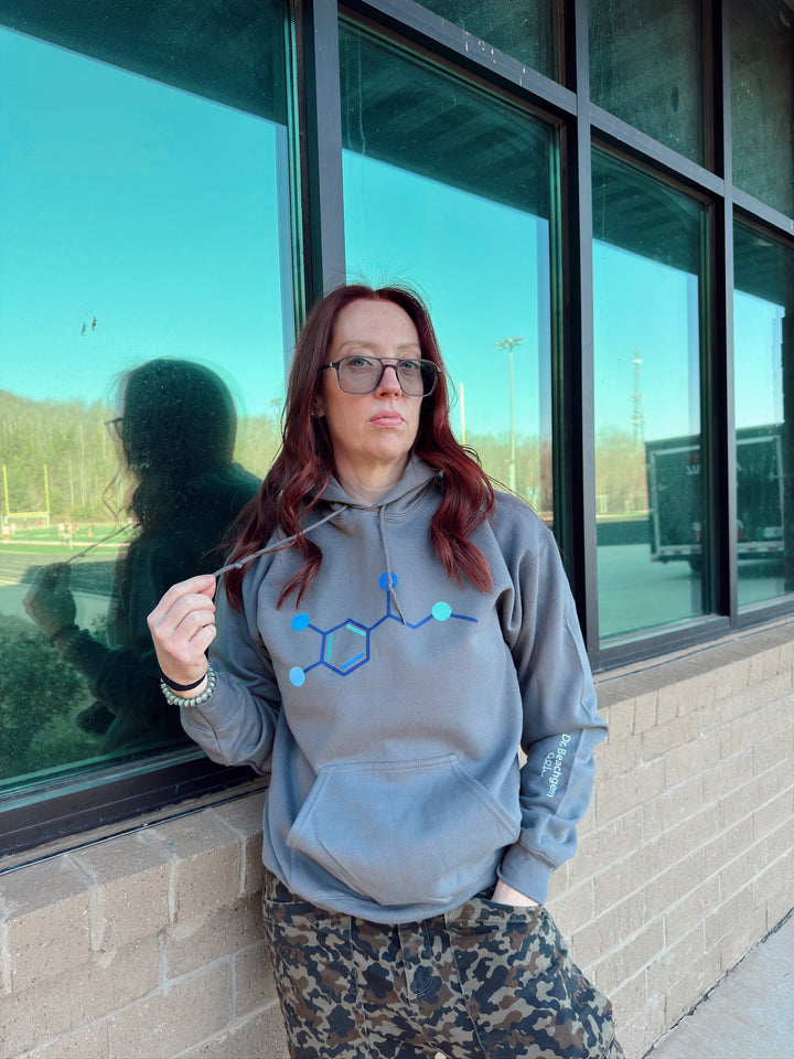 Ladyspinedoc wearing a gray molecule design hoodie outside