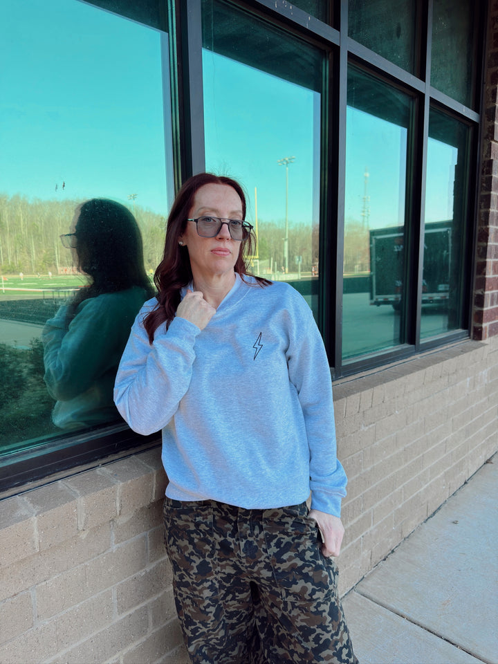 Ladyspinedoc showing front of gray Spinal Strength sweatshirt