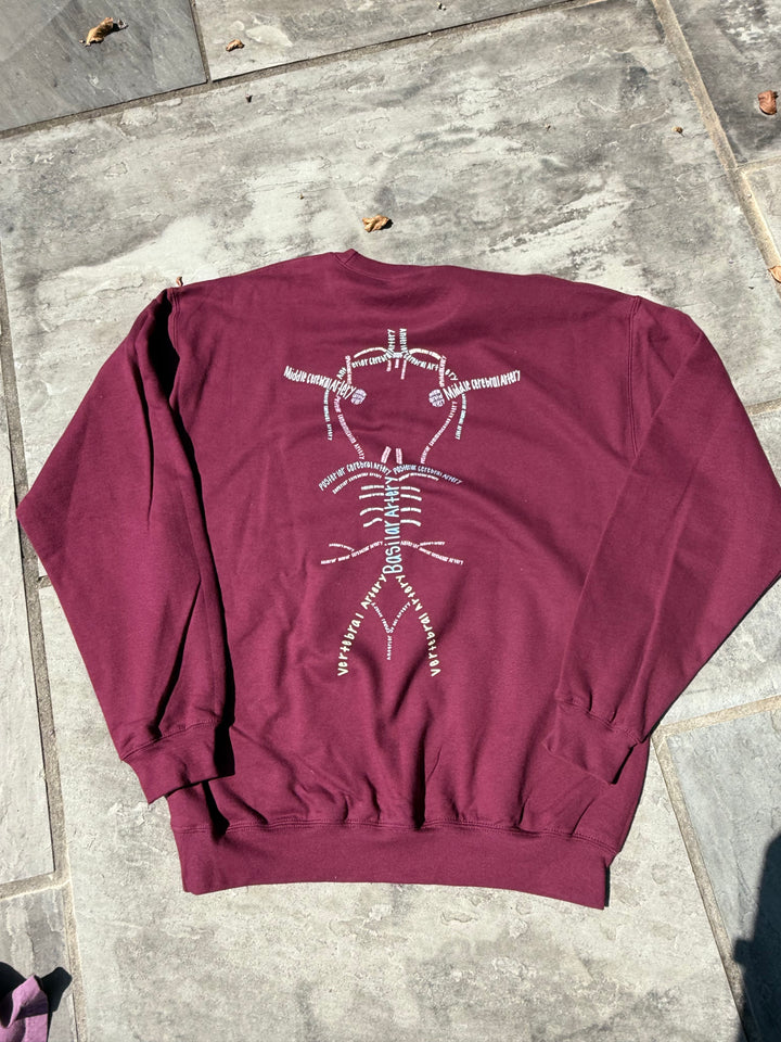 Back of Whatchu Talkin’ About Willis Sweatshirt on stone pavement