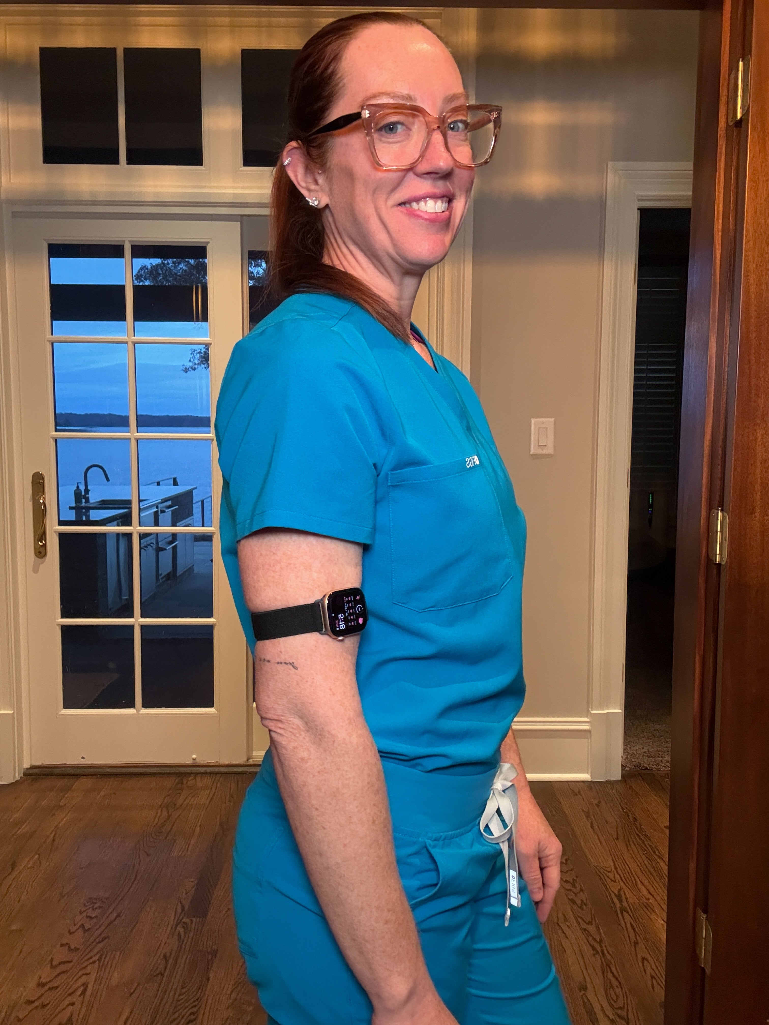 Right side view of Dr. Betsy Grunch / Ladyspinedoc wearing the bicep smartwatch band on her upper right arm.
