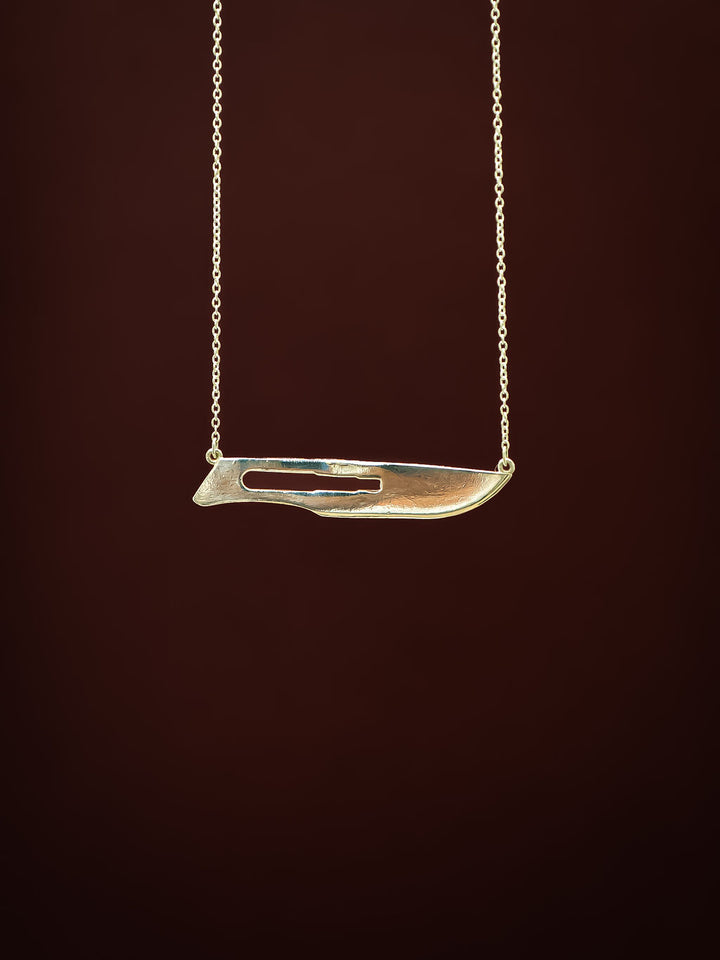 Close up of sterling silver 10 Blade Scalpel Pendant Necklace