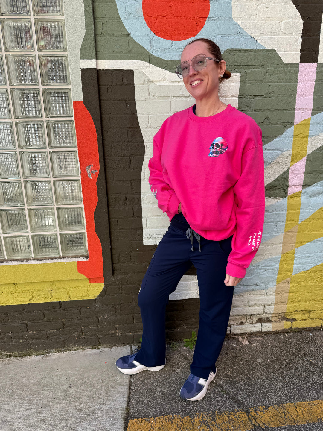 Ladyspinedoc wearing The Power Within Crewneck Sweatshirt - Pink Shirt with Lightning Bolts, Skull, and Motivational "BE THE ENERGY YOU WANT TO ATTRACT" Motto