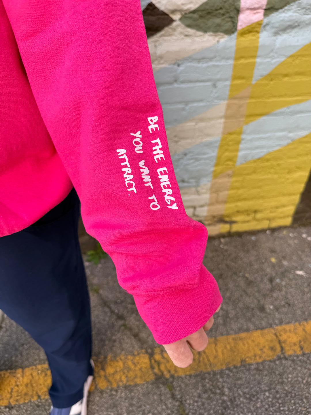 The Power Within Crewneck Sweatshirt - Pink Shirt with "BE THE ENERGY YOU WANT TO ATTRACT" Motto on sleeve
