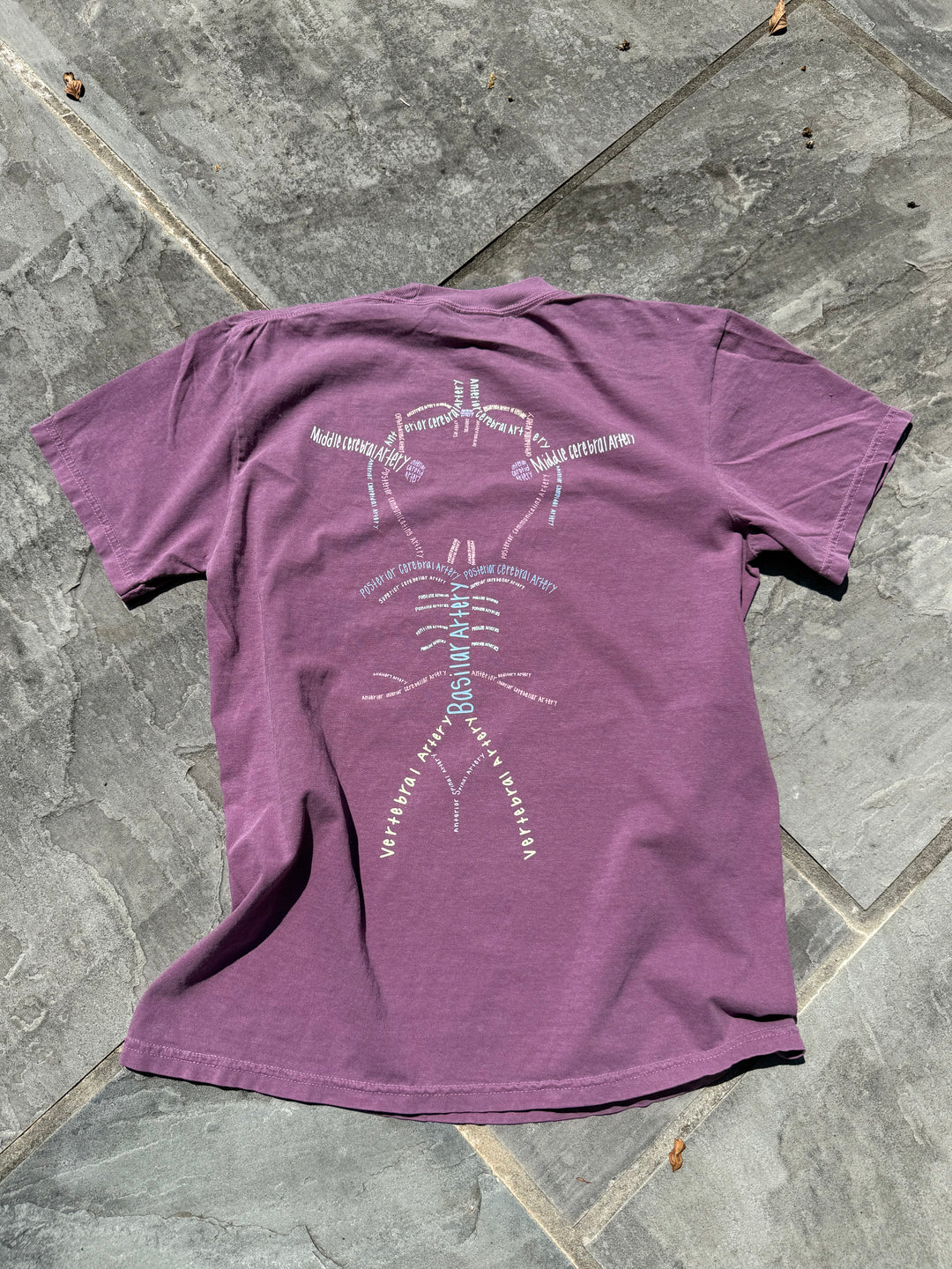 Back of Whatchu Talkin’ About Willis T-shirt on a gray floor